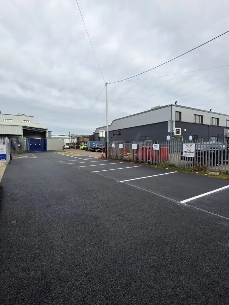 Industrial estate car park freshly surfaced with white bay lines